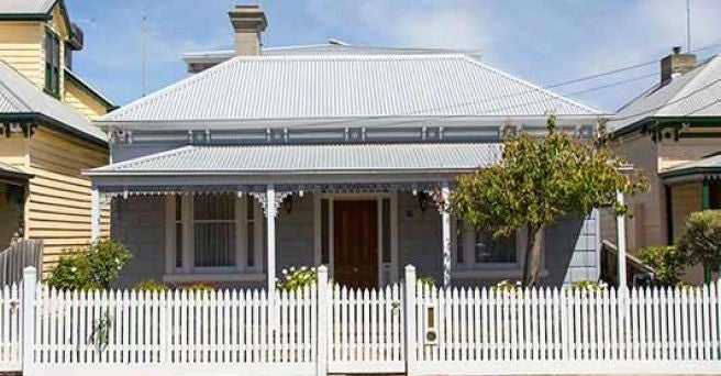 Federation style home with white picket fence