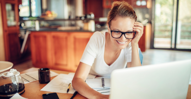 Woman wearing glasses in office smiling