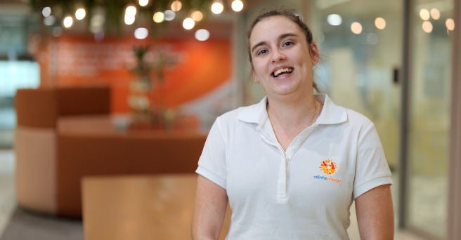 Bridie O'Brien smiling in Alinta office